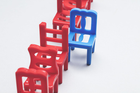 Row of chairs with one odd one out. Job opportunity. Business leadership. recruitment concept.の写真素材