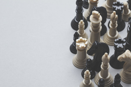 Chess game pieces on a grey background. Strategy conceptの写真素材