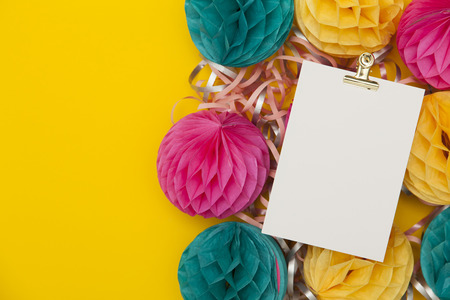 Bright party honeycomb pom pom decorations with blank labelの写真素材