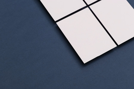 Blank white business card postcard flyer on a blue backgroundの写真素材