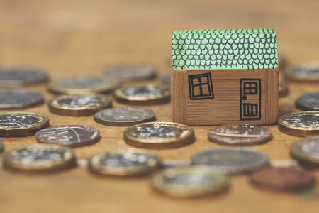 House model with coins. Home finance conceptの写真素材