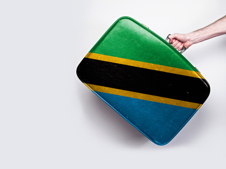 Tanzania flag on a vintage leather suitcase.の写真素材