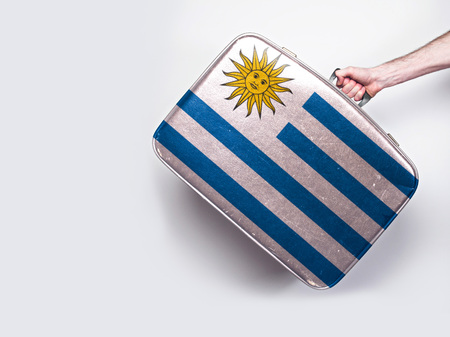 Uruguay flag on a vintage leather suitcase.の写真素材