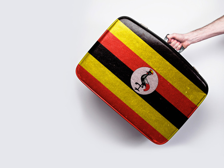 Uganda flag on a vintage leather suitcase.の写真素材