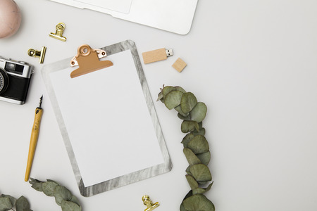 Clipboard with blank paper and accessories mockup, top viewの写真素材