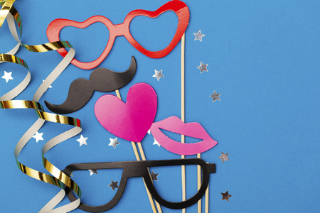 Party background with funny props on a blue background. Wedding party photobooth.の写真素材