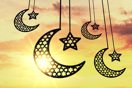 Ramadam Kareem moon and star against sunrise/sunset background. 3D Renderingの写真素材