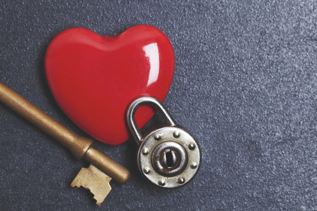 Valentines unlock love concept. Red heart with padlock and keyの写真素材
