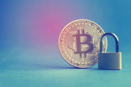 bitcoin currency coin with a padlock. Digital currency security conceptの写真素材