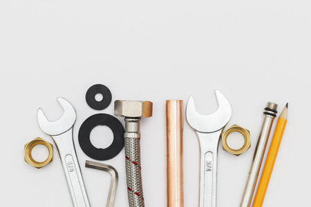 Plumbing essential tools on a plain backgroundの写真素材