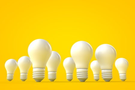 White lightbulbs against a yellow background, bright idea concept. 3D renderingの写真素材