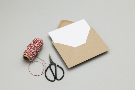 Blank white card with kraft brown paper envelope template mock upの写真素材