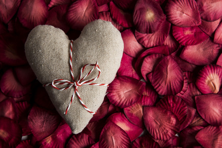 St Valentines day love heart and rose petals