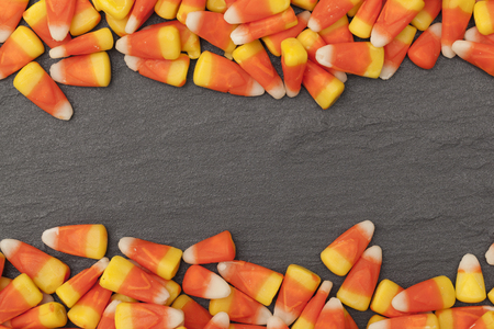 Halloween candy corn sweets on a slate backgroundの写真素材