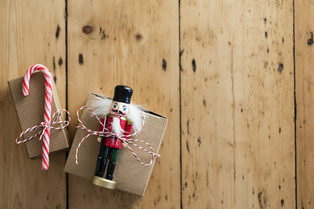 Christmas present wrapped boxes on a wooden backgroundの写真素材