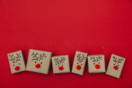 Christmas gift boxes with reindeer facesの写真素材