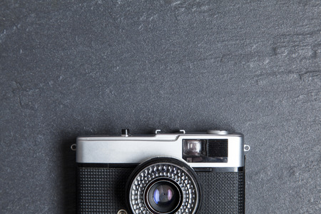 Vintage film camera on a slate backgroundの写真素材