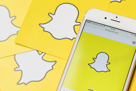 OXFORD, UK - JANUARY 9th 2017: An apple iPhone showing the Snapchat application alongside other Snapchat logos. Snapchat is a popular social media application for sharing messages, images and videosのeditorial素材