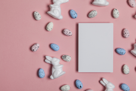 Easter holiday background with eggs, bunnies and a blank label signの写真素材