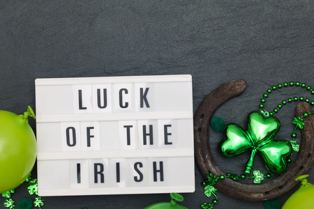 Luck of the irish message on a lightbox with St Patricks decorationsの写真素材