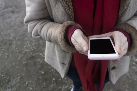 Young hipster woman using a smarphoneの写真素材