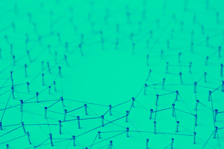 A large grid of pins connected with string. Communication, technology, network conceptの写真素材