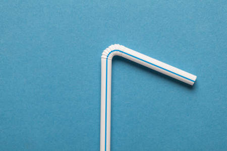 Plastic straws on a blue backgroundの写真素材