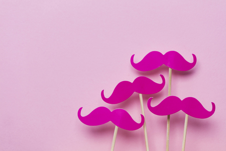 Pink moustache on a pink background. Modern masculinity conceptの写真素材