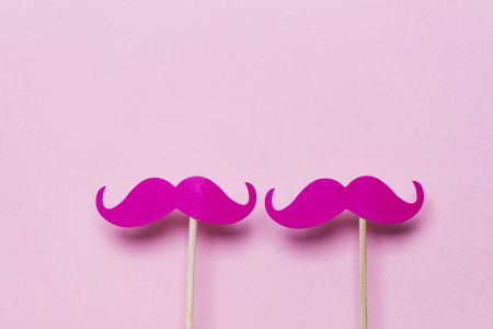 Pink moustache on a pink background. Modern masculinity conceptの写真素材