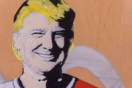 ROME, ITALY - JUNE 20th 2018: Graffiti of USA president Donald Trump on a wall in Rome