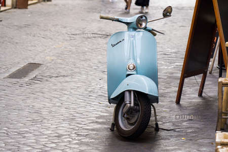 ROME, ITALY - JUNE 20th 2018: A classic Italian Vespa scooter parked in a street in Rome.のeditorial素材