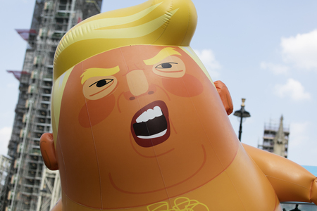 LONDON, UK - July 14th 2018: A large balloon shaped like Donald Trump in Central London during the protest against President Trump's visit to the UKのeditorial素材