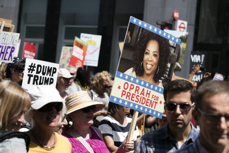 LONDON, UK - July 14th 2018: A group of people holding placards for potential Oprah Winfrey 2020...