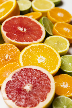 Citrus fruit background. Slices of grapefruit, orange, lemon and limeの写真素材
