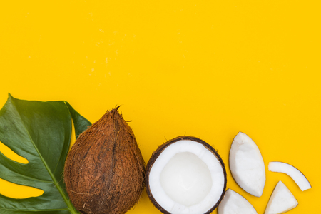 Tropical summer coconut on a yellow background.の写真素材