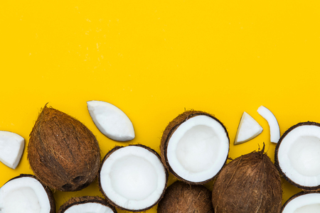 Tropical summer coconut on a yellow background.の写真素材