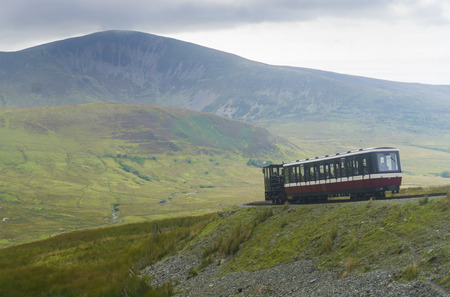 SNOWDONIA, WALES: AUGUST 14th 2018: Snowdon mountain railway train making its way up to the summit of mount Snowdonのeditorial素材