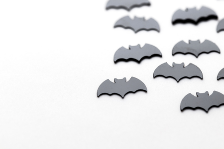 Black bat shapes on a white background. Halloween backgroundの写真素材