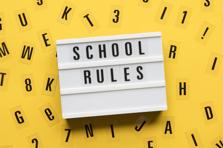 School rules lightbox message on a bright yellow backgroundの写真素材