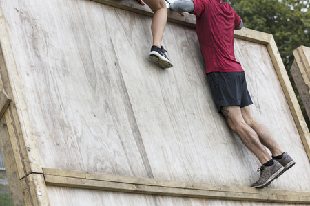 LONDON, UK - SEPTEMBER 8th 2018: Participants take part in a rough runner obstacle course race in...