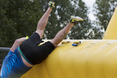 LONDON, UK - SEPTEMBER 8th 2018: Participants take part in a rough runner obstacle course race in Londonのeditorial素材