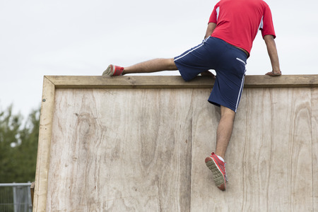 LONDON, UK - SEPTEMBER 8th 2018: Participants take part in a rough runner obstacle course race in Londonのeditorial素材