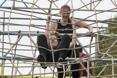 LONDON, UK - SEPTEMBER 8th 2018: Participants take part in a rough runner obstacle course race in...