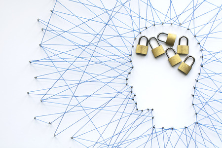 Human head shape made from a large grid of pins connected with string. Communication technology and mental health conceptの写真素材