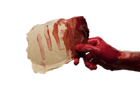 Bloody hand holding a blank sign. halloween horror concept