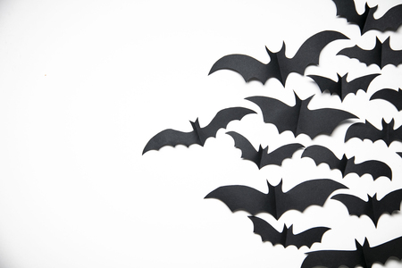 Halloween paper bat decorations on a white background.の写真素材