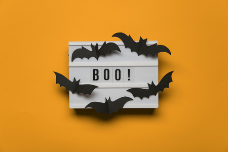 Boo! halloween lightbox message with black scary batsの写真素材