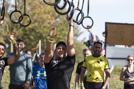 LONDON, UK - September 13th 2018: Participants take part in a Tough Mudder 5K obstacle race in London.のeditorial素材