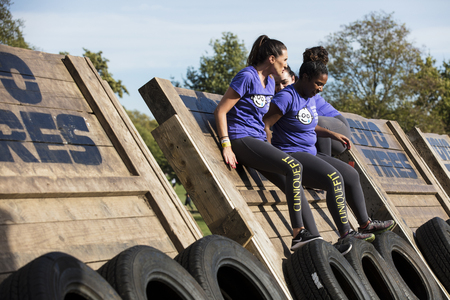 LONDON, UK - September 13th 2018: Participants take part in a Tough Mudder 5K obstacle race in London.のeditorial素材