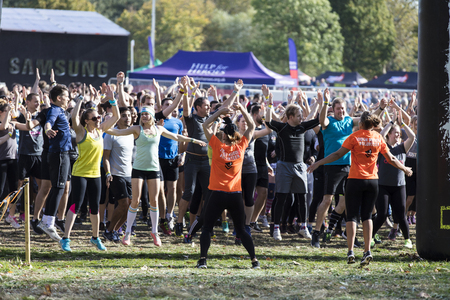 LONDON, UK - September 13th 2018: Participants take part in a Tough Mudder 5K obstacle race in London.のeditorial素材
